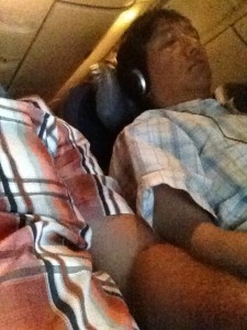 My nemesis in this flight's "Armrest War". . . thankfully he shed his scratchy, blue sweater.